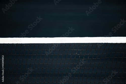 Beach volleyball and beach tennis net on dark background. Professional sport concept © Augustas Cetkauskas