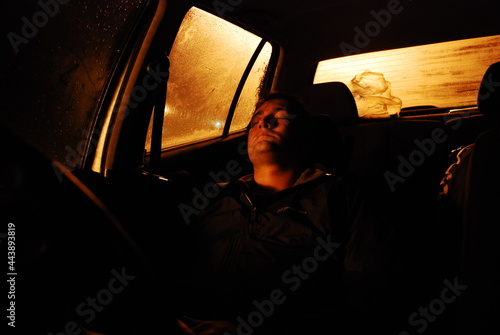 Person sleeping in car