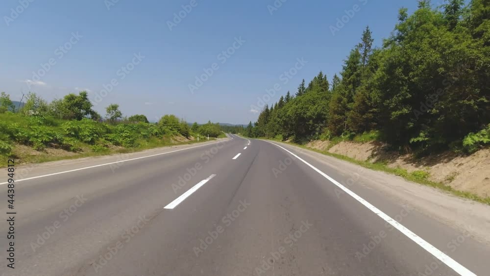 Motorcycle riding at mountains on the asphalt road, summer moto traveling, moto adventure concept, first person point of view, pov touring Motorcycle riding at mountains on the asphalt road, summer moto traveling, moto adventure concept, first person point of view, pov touring
