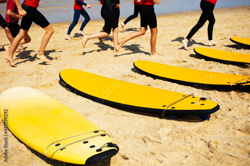 Surfers warm up in school group to go into sea
