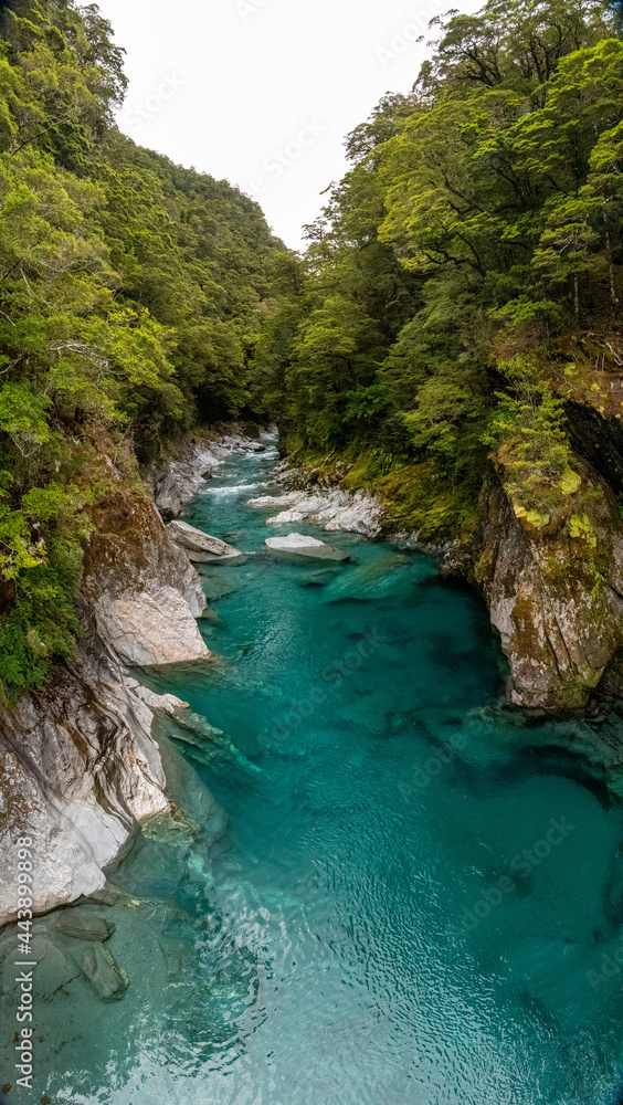 Colorful blue mountain river at the Haast pass, New Zealand Colorful blue mountain river at the Haast pass, New Zealand