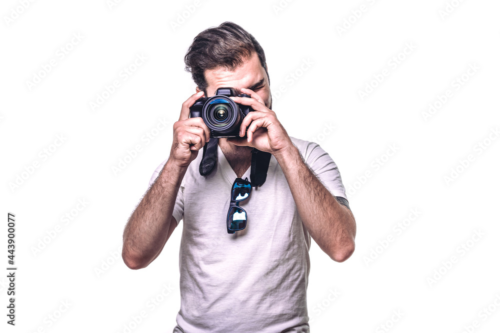 Man holding camera. Boy takes photo in studio. Professional photographer. Hobby Man holding camera. Boy takes photo in studio. Professional photographer. Hobby