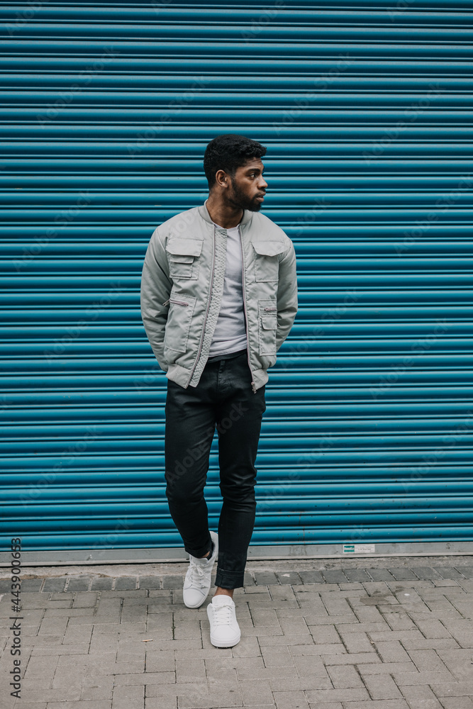 Good looking young black man in trendy fashion urban street clothes looking stylish, trendy and urban Good looking young black man in trendy fashion urban street clothes looking stylish, trendy and urban
