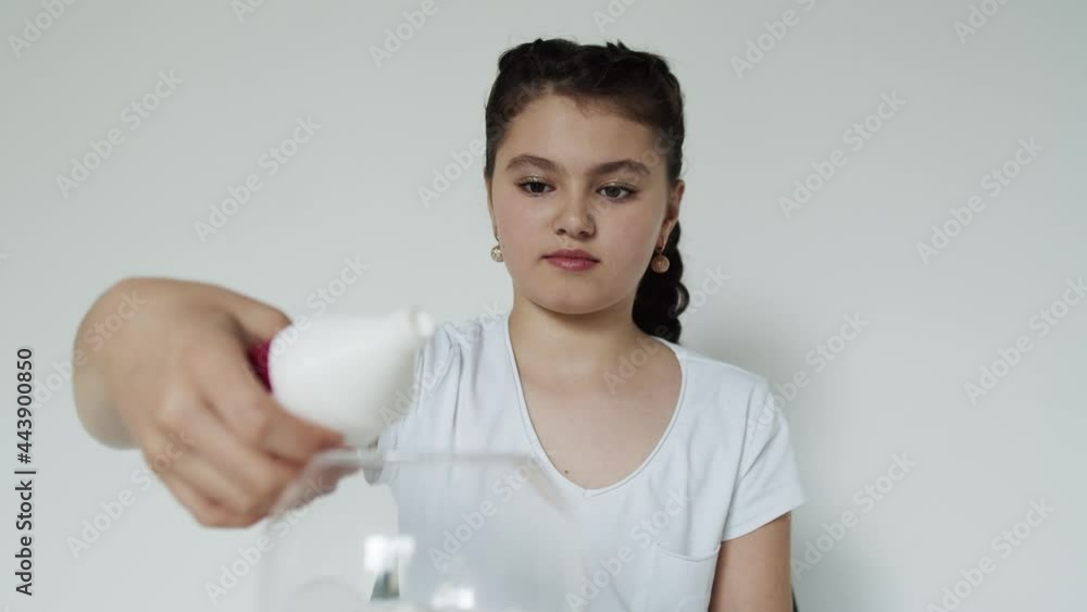 Close up girl pours out all the glue from the bottle Close up girl pours out all the glue from the bottle