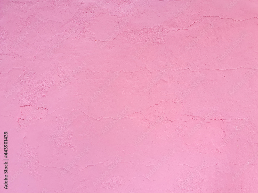 Texture of rough cracked pink stucco texture background. Decorative plaster on the wall.