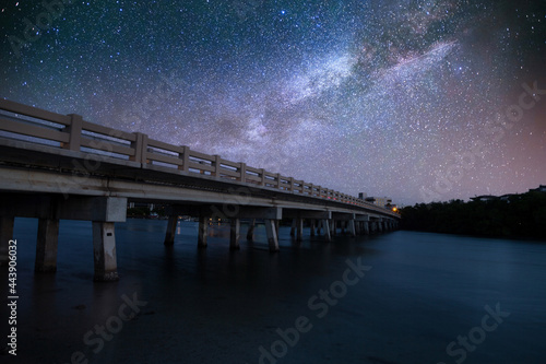 Starry Night sky over bridge over Hickory Pass leading to the ocean in Bonita Springs