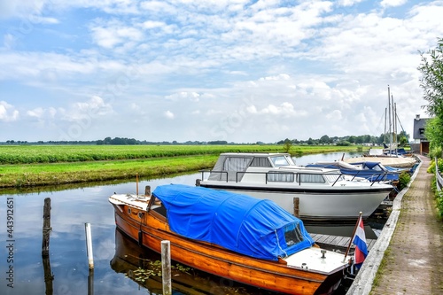 Fototapeta Naklejka Na Ścianę i Meble -  View of the boats and the beautiful landscape of Blokzijl.  Blokzijl, Overijssel, Netherlands, Holland, Europe.