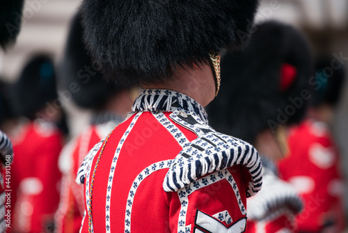 Queen's Guard in traditional uniform at the Buckingham Palace, London, United Kingdom photo