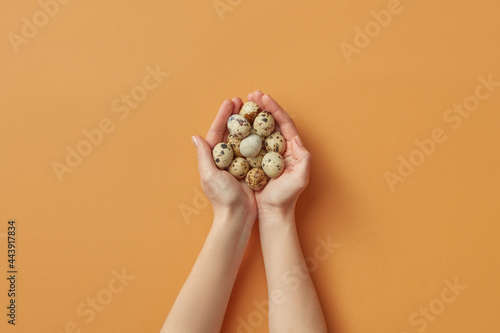 Woman holding quail eggs