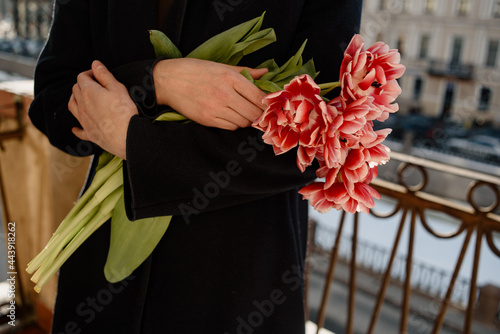 Woman holding bouquet of tulips photo
