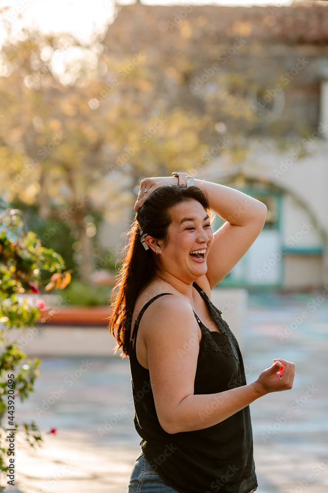 Laughing woman with cochlear implant Laughing woman with cochlear implant