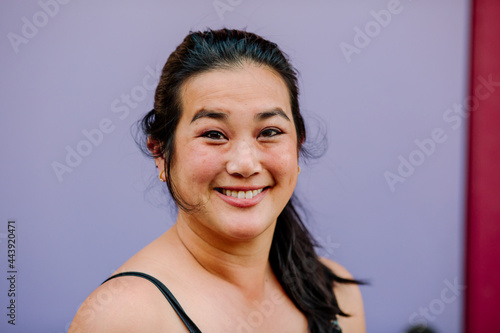 Head shot of smiling mid-30's Asian woman 