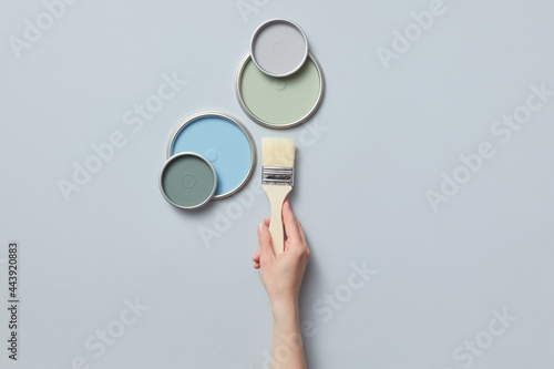 Woman holding paint brush photo