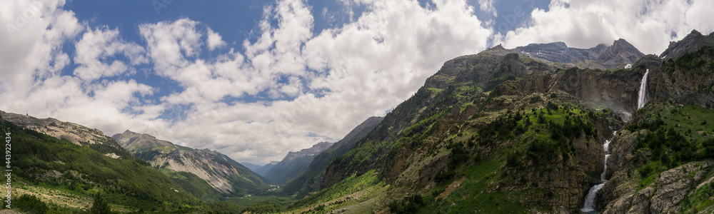 Panorama of Valle de Pineta with waterfall Cascada del Cinca from viewpoint in Pyrenees, Spain