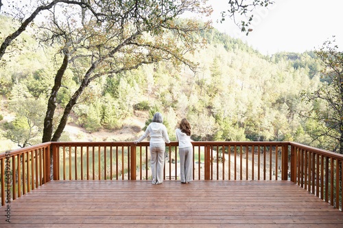 Two women friends looking at view of nature