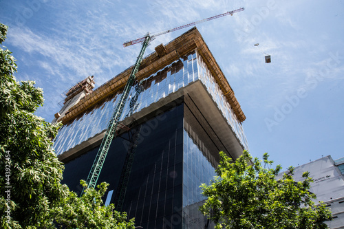 Apartment building constructions, with big crane in motion