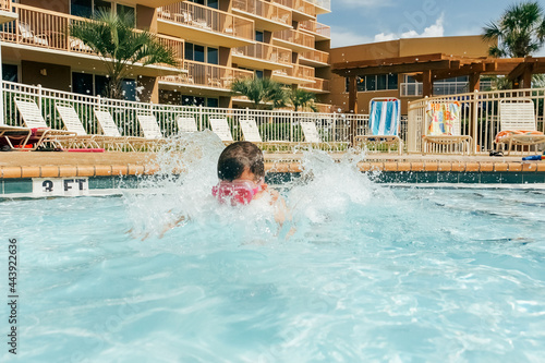 Big splashing into a swimming pool.  photo