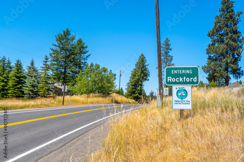 An Entering Rockford sign at the outskirts of the rural small town of Rockford, Washington, in the Palouse area of the Inland Northwest of the USA. photo