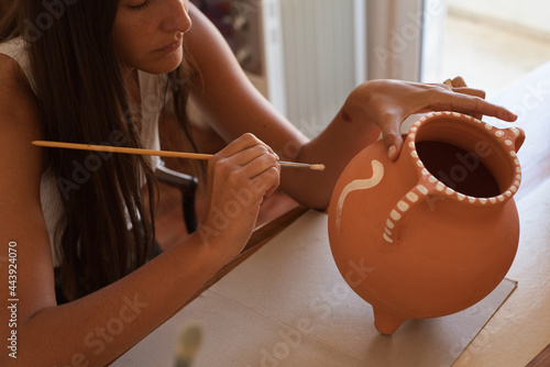 Inspire artist working on a terracotta piece photo