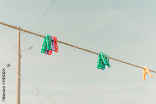 Laundry tongs on the clothesline photo