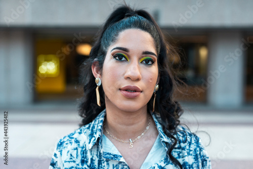 Young impassive woman looking at camera  photo