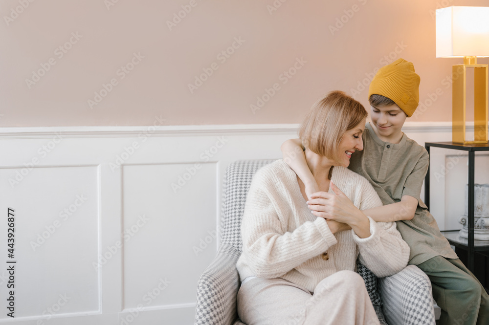 Happy mother and son hugging each other Happy mother and son hugging each other