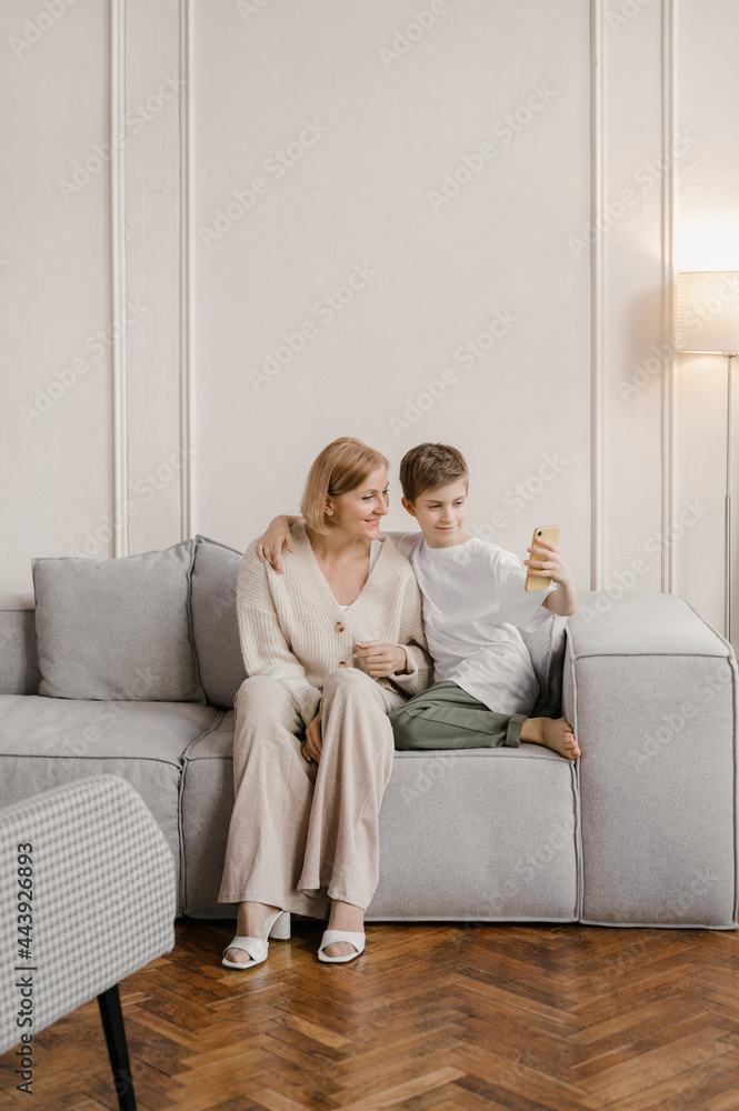 Mother and child taking selfie at home Mother and child taking selfie at home