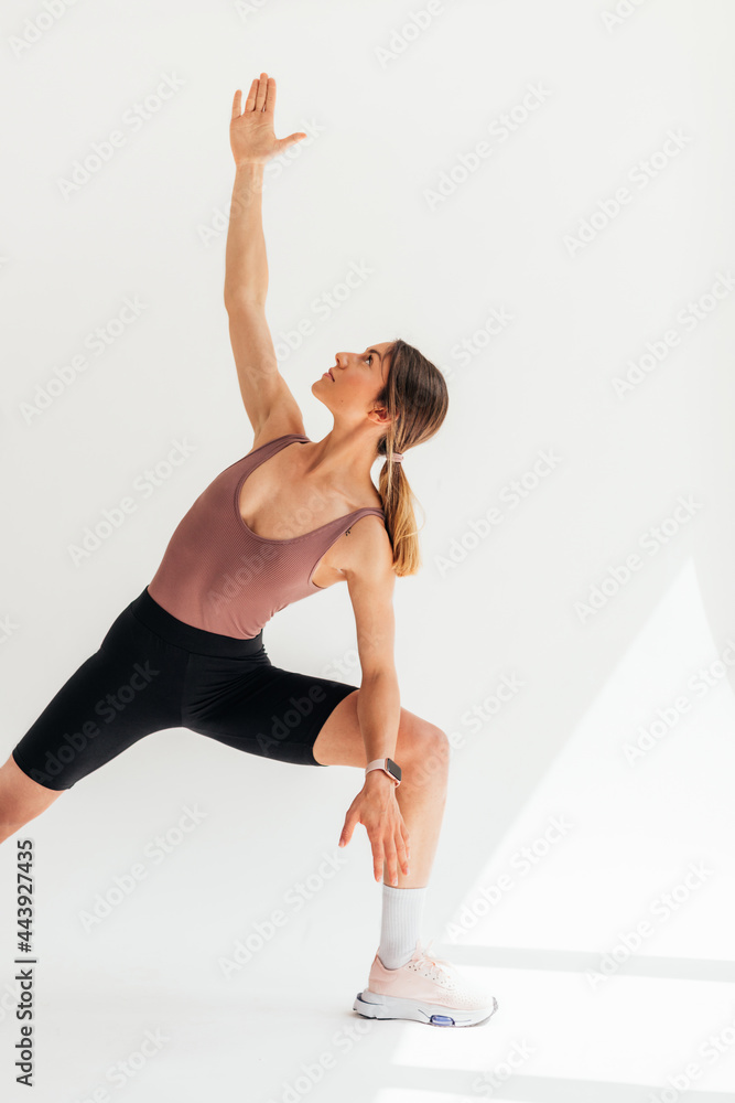 Sportswoman Exercising in Studio Sportswoman Exercising in Studio