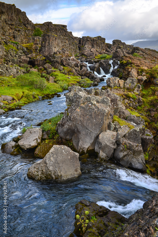  A picturesque cascading river at the UNESCO World Heritage-listed Thingvellir National Park, Iceland
