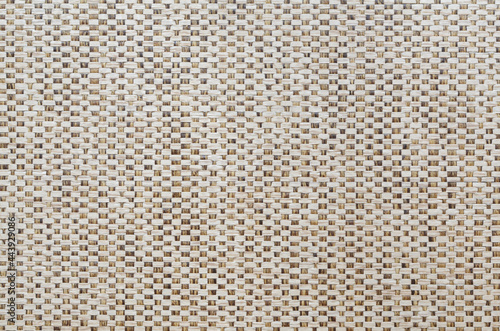 brown mesh textile background. Texture of fabric with wood bark woven in a grid pattern