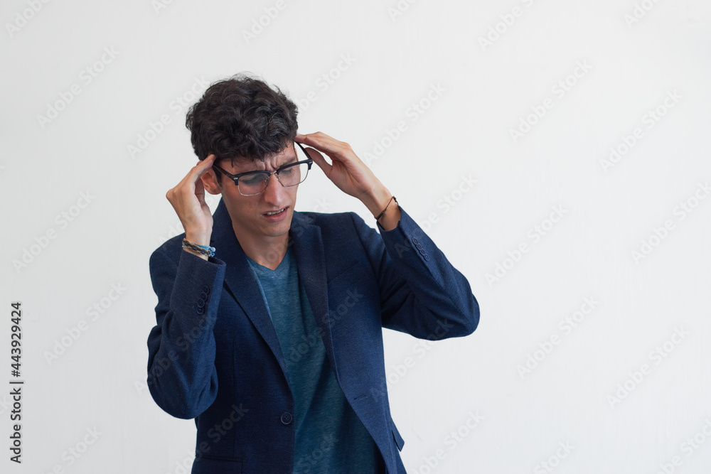 Young man with headache, white background, copy space. Young man with headache, white background, copy space.