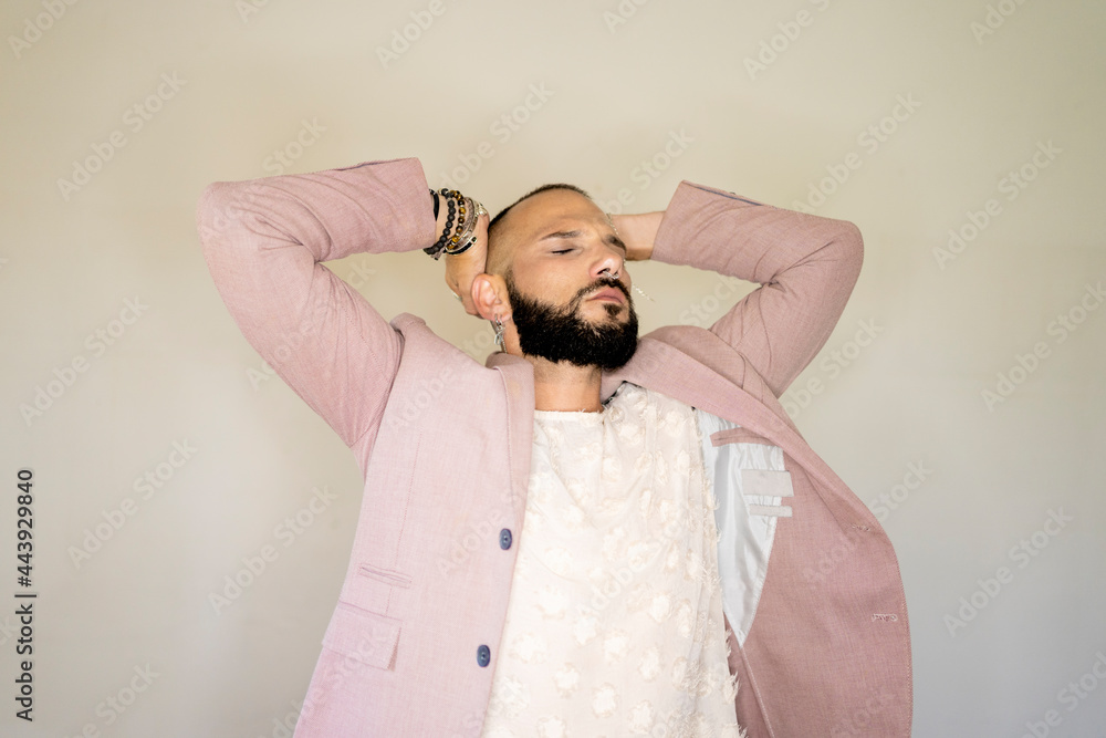 © Eloisa Ramos/Stocksy - Portrait of male model posing with the closed eyes