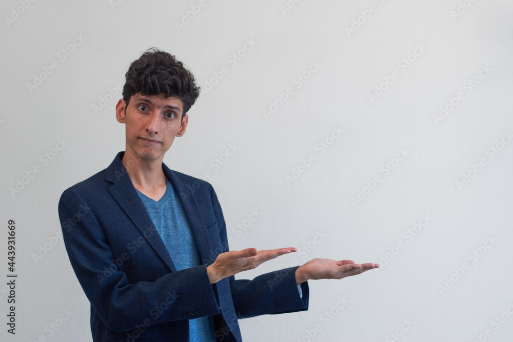 Young man presenting copy space, with white background Young man presenting copy space, with white background