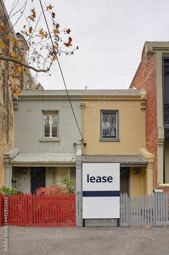 Inner city home with Lease sign board photo