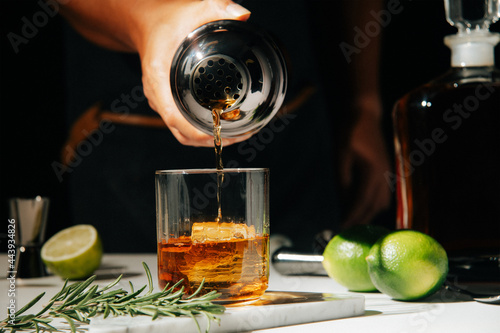hand pouring cocktail