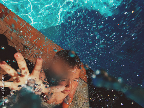 Swimming pool, boy boy in the shower. photo