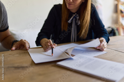 Lawyer reviewing her client's papers photo
