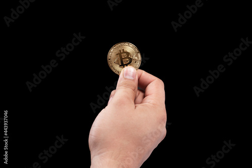 Hand holding a bitcoin coin on a alpha background