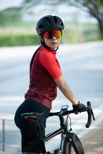 Portrait caucusian woman posing on her bicycle