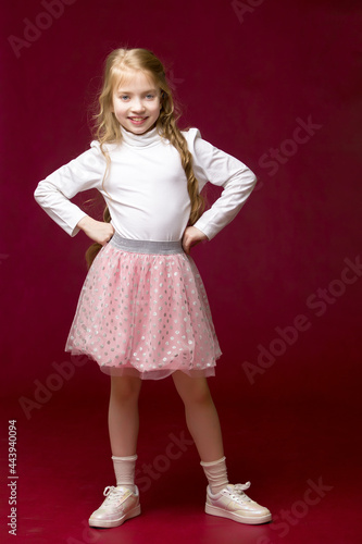 Cute little girl, full length studio portrait