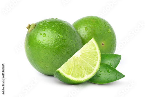 Natural  fresh lime with sliced and water droplets  isolated on white background.