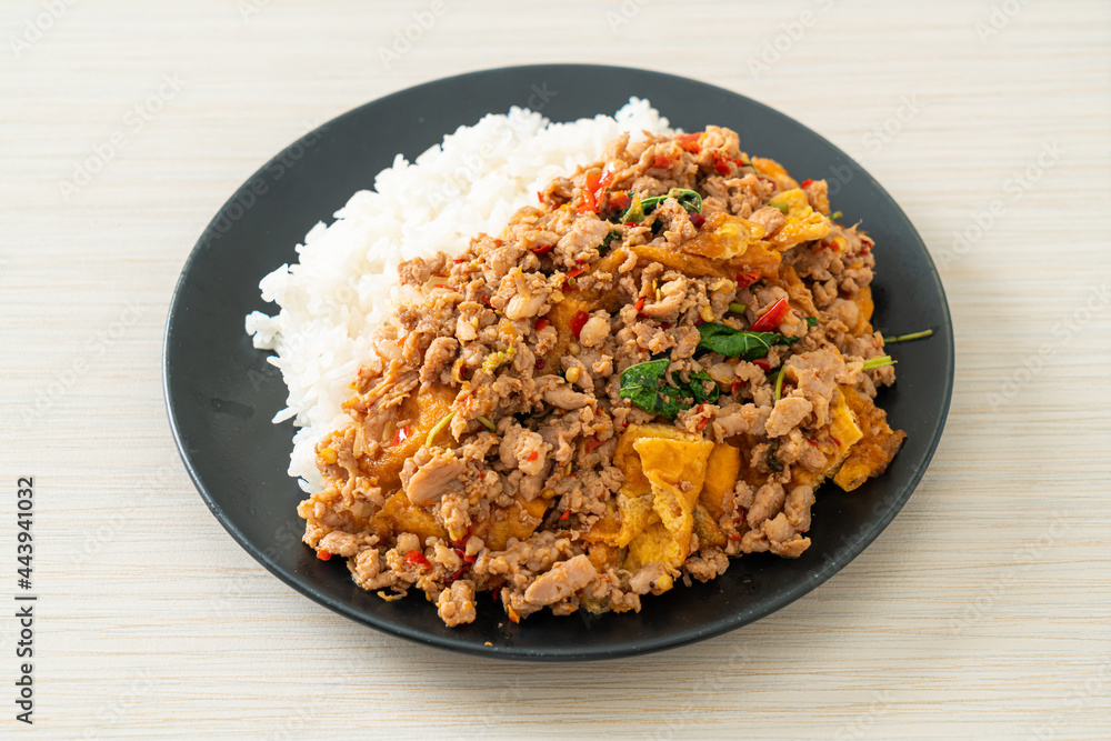 stir-fried minced pork with basil and egg topped on rice stir-fried minced pork with basil and egg topped on rice