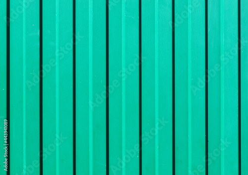Panorama of green corrugated surface of metal or galvanized steel texture