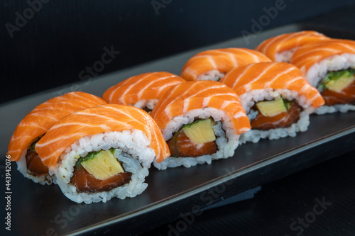 Salmon Maki Roll Sushi on a black plate