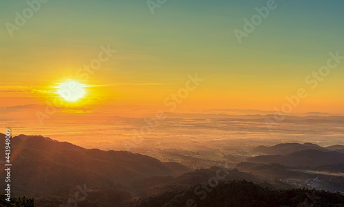 Sunrise landscape panoramic view with the sun and misty at Chiang Rai province northern of Thailand