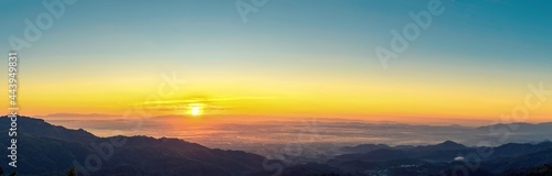 Sunrise landscape panoramic view with the sun and misty at Chiang Rai province northern of Thailand