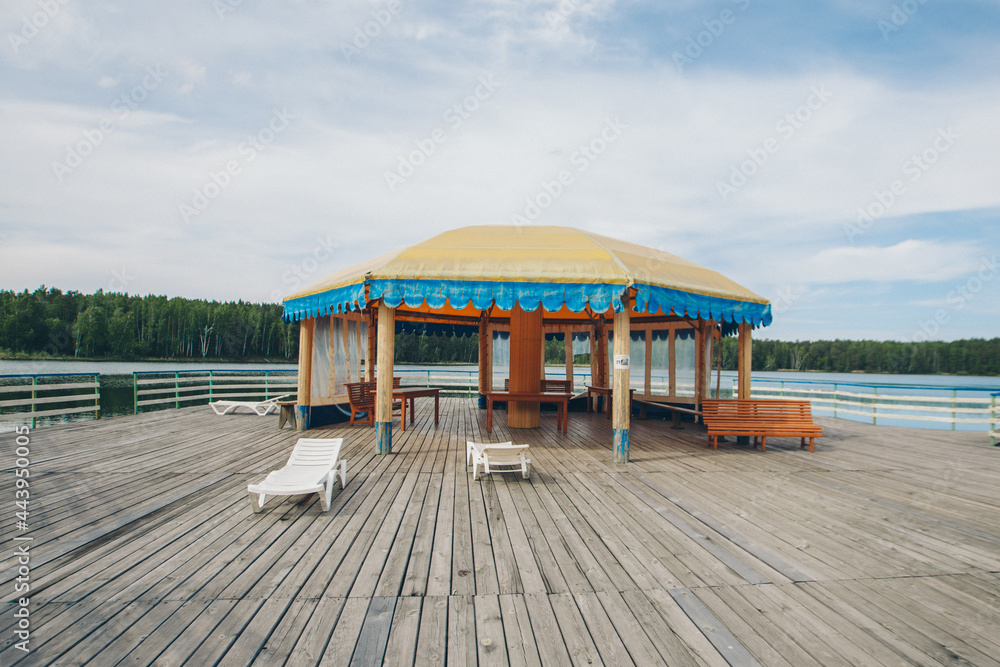 View of the gazebo by the lake. recreation area by the water View of the gazebo by the lake. recreation area by the water