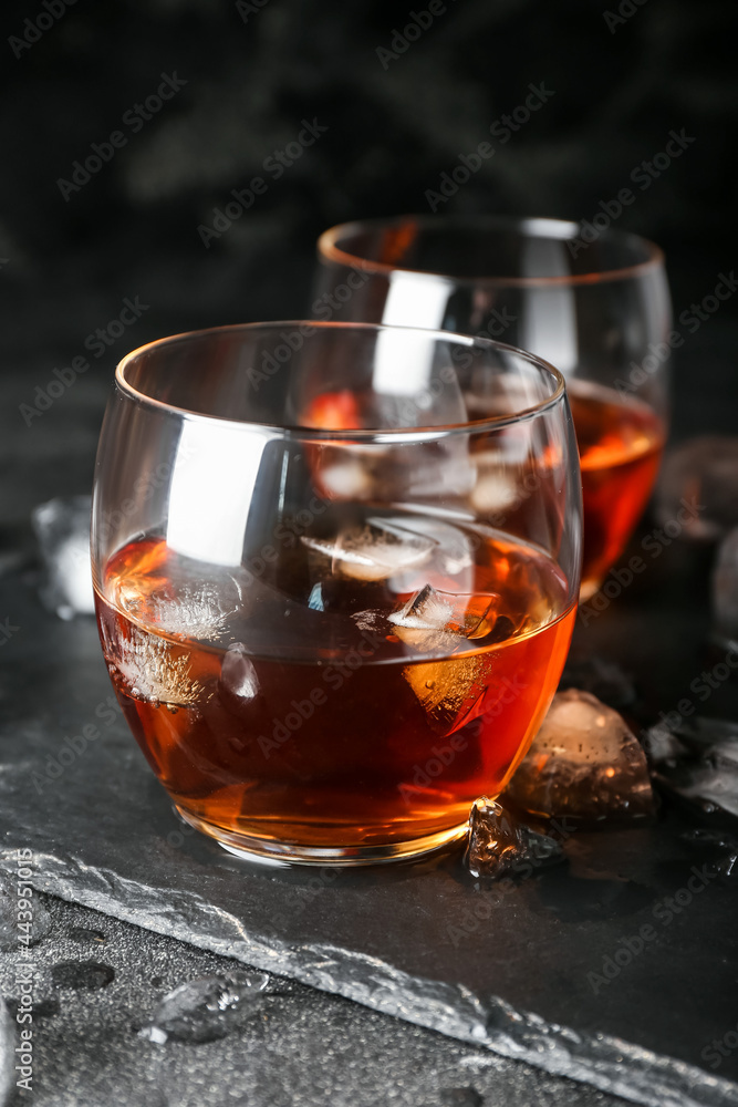 Glasses of cold whiskey on dark background Glasses of cold whiskey on dark background