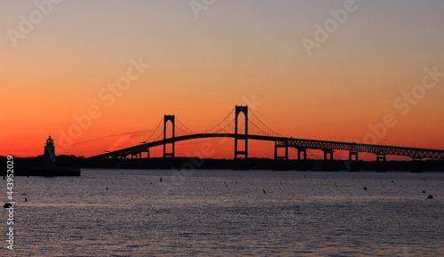 the claiborne pell newport bridge from jamestown to newport,  rhode island, over narragansett bay, with a spectacular sunset photo