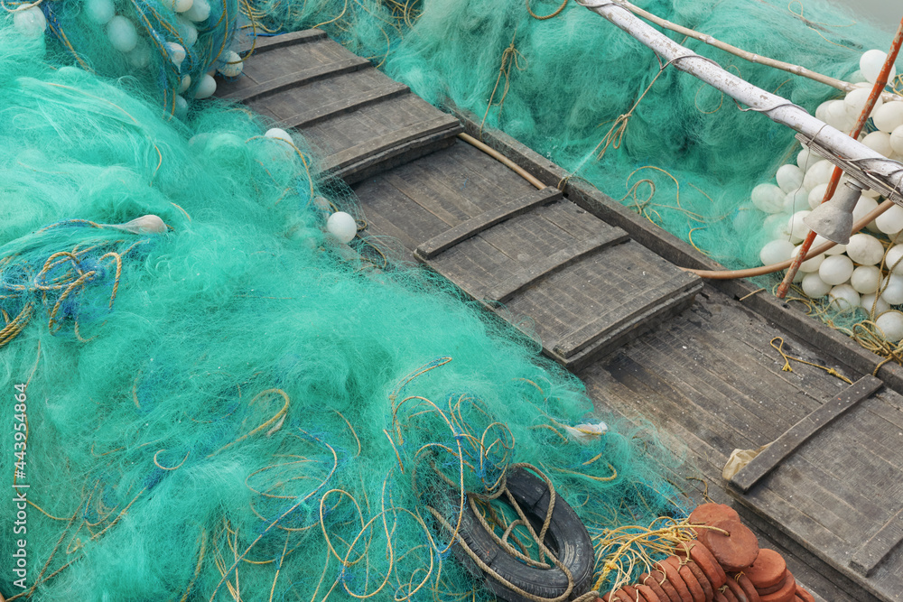 Closeup of nylon fishing nets, with plastic made inflatable balls attached  to it. At a fishing village near Fraserganj, West Bengal. Stock Photo